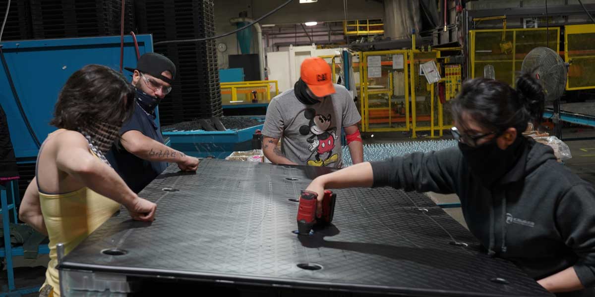 Penda employees working on plastic product